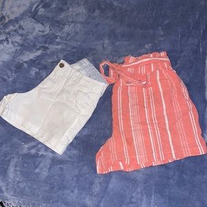 Two shorts, white short jeans and pink cotton short with adjustable waist.